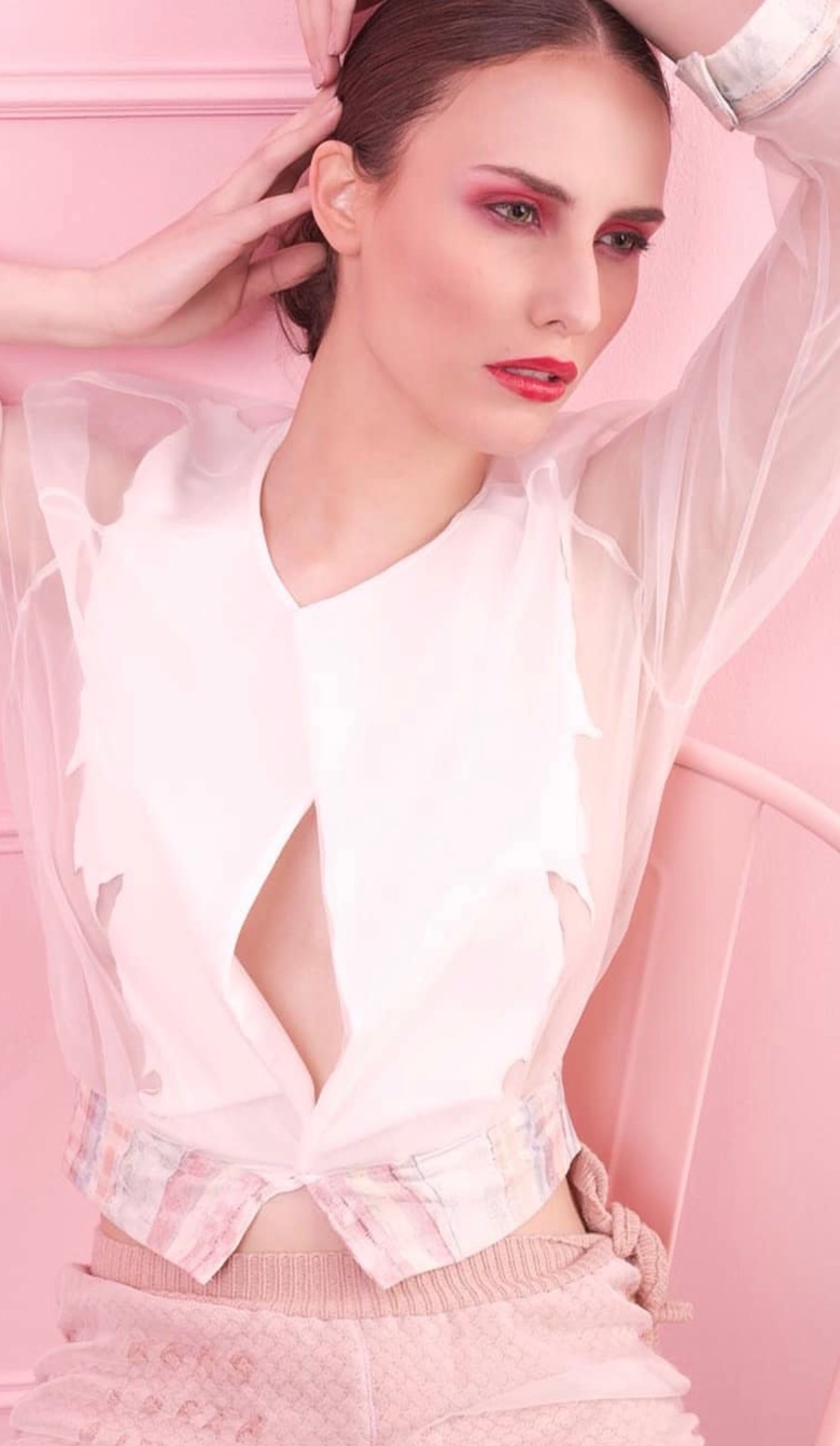 Editorial portrait wearing a translucent white and pink look