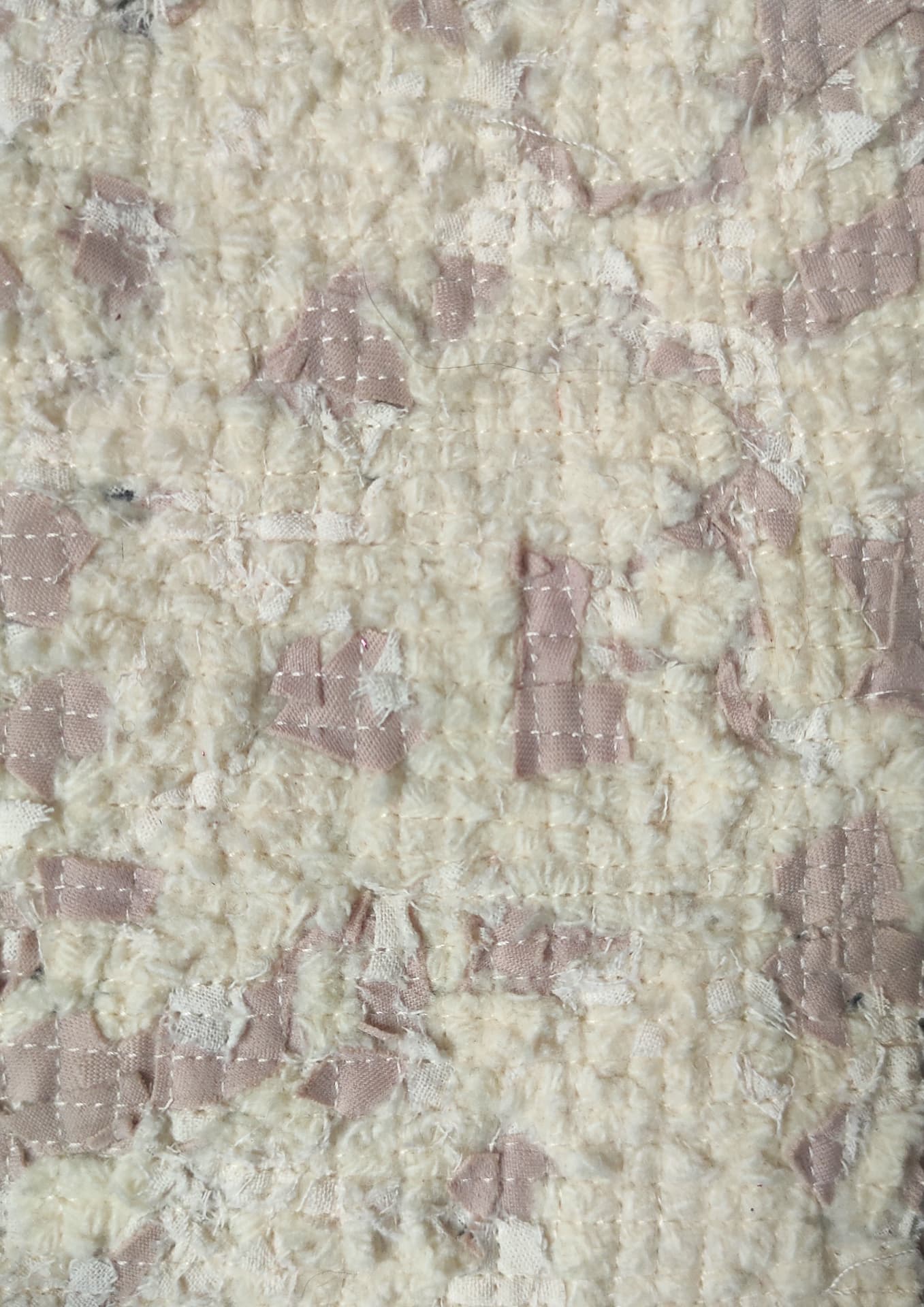 Cream and dusty-pink TexCell surface with visible stitching lines.