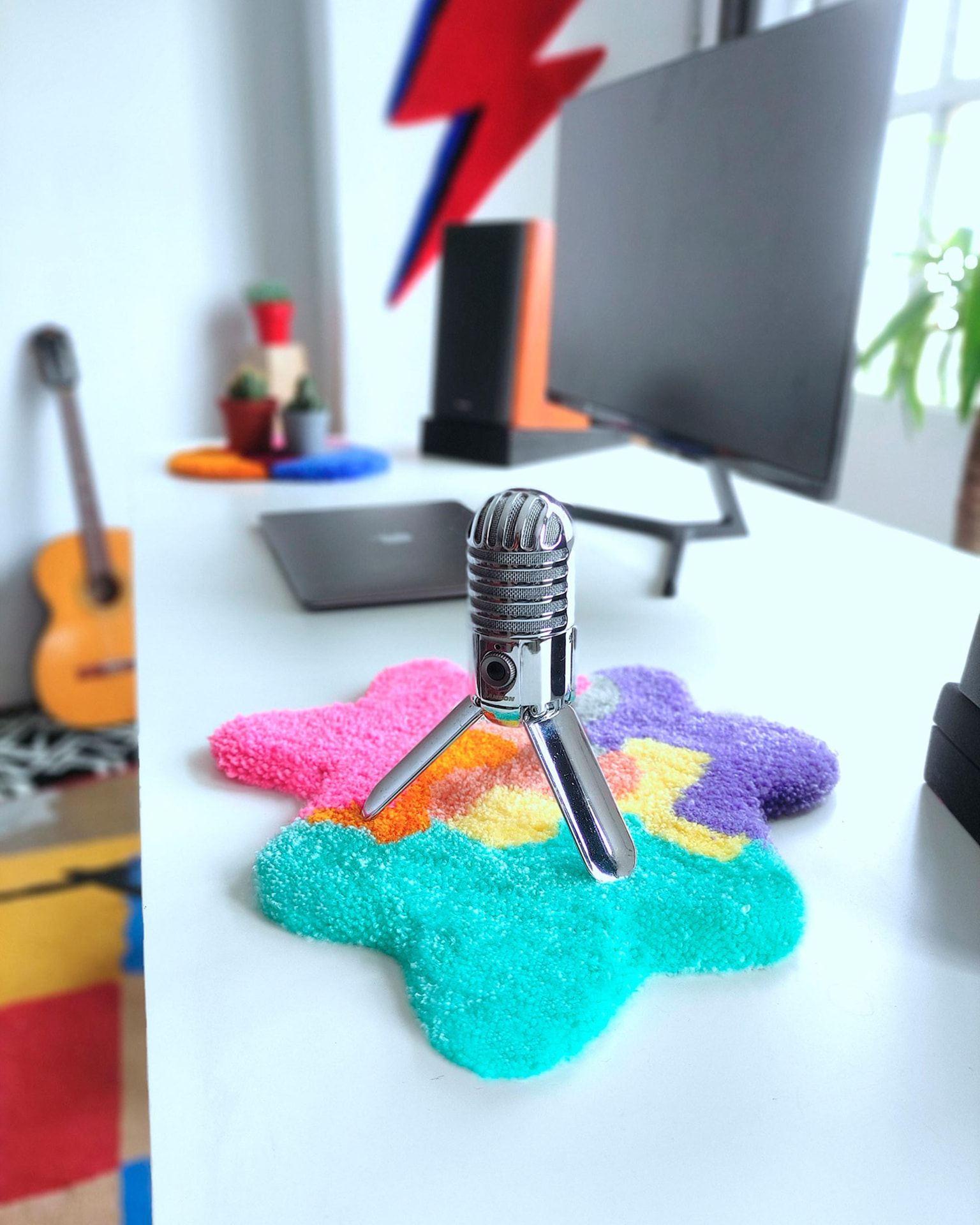 Tufted coaster under a desk microphone