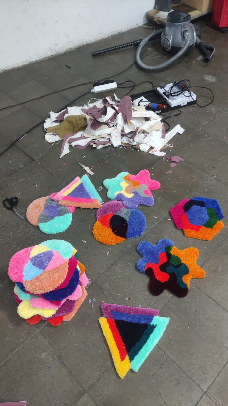 Finished tufted pieces arranged on the floor