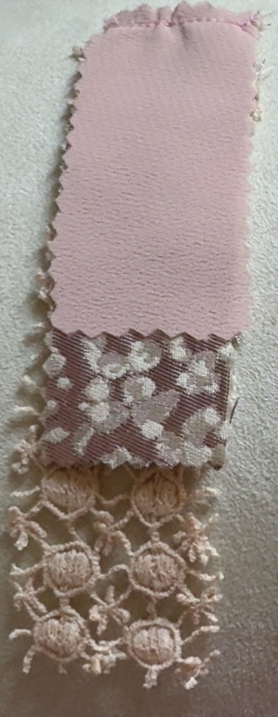 Layered pink fabric and lace swatches used in the TexCell material study.
